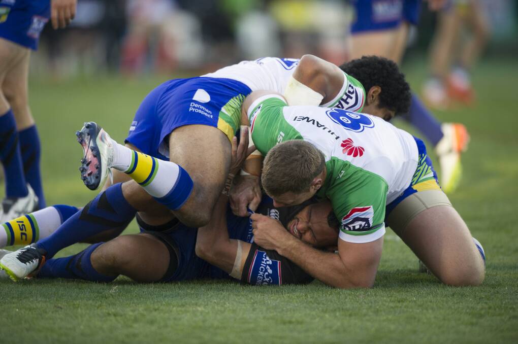 Canberra Raiders v Canterbury-Bankstown Bulldogs in Canberra sees Tyrone Phillips tackled by Shannon Boyd and Sia Soliola. Photo: Rohan Thomson The Canberra Times