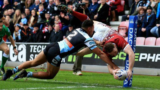 Spectacular: Joe Burgess scores the opening try for Wigan. Photo: Jan Kruger