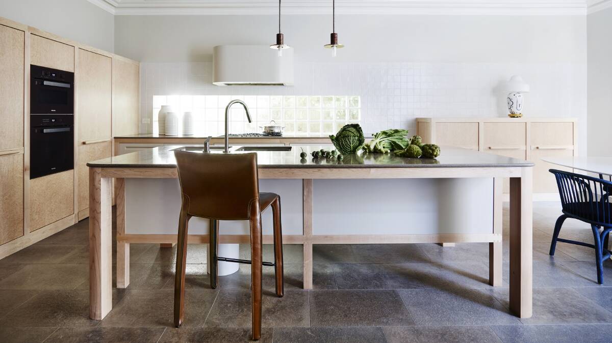 The kitchen and informal dining design is based on a contemporary interpretation of a farmhouse kitchen.