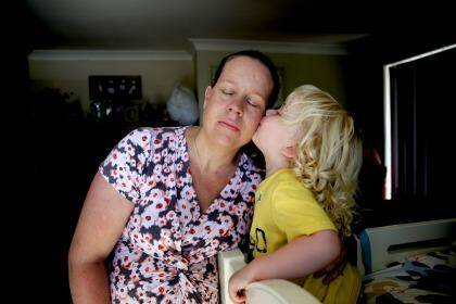 Helped through depression: Molly Hutcherson receives a kiss from son Clem, 2. She suffered mental health problems after giving birth.  Photo:  Edwina Pickles