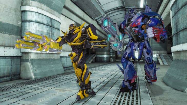Bumblebee and Optimus Prime move out in <i>Transformers: Rise of the Dark Spark</i>.