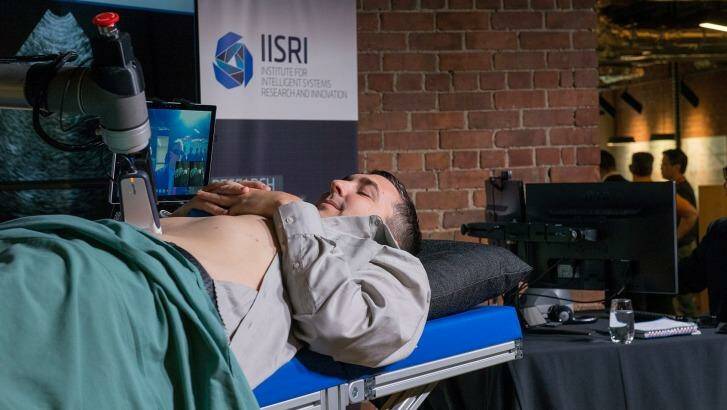 The robotic arm performing an ultrasound.  Photo: Jesse Marlow