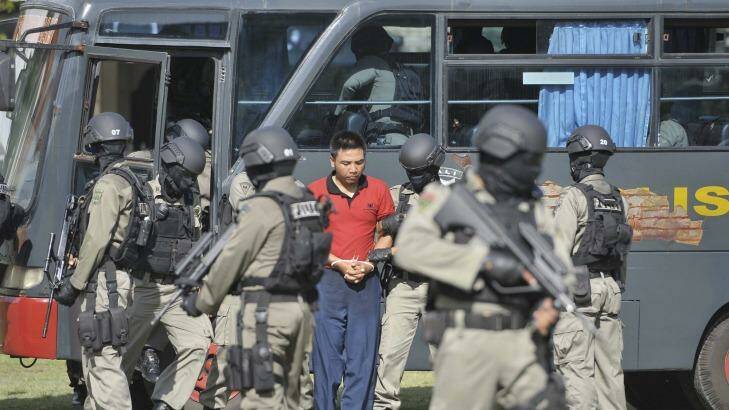 Elite police carry out a mock transfer of the Australians to the prison island where they will be killed. Photo: Reuters/Antara