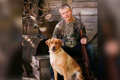 FAMILY TIES: Nebraska senior Kalen Mazenkowski poses with a rifle given to him by his grandfather. Photo: Brian Baer Photography
