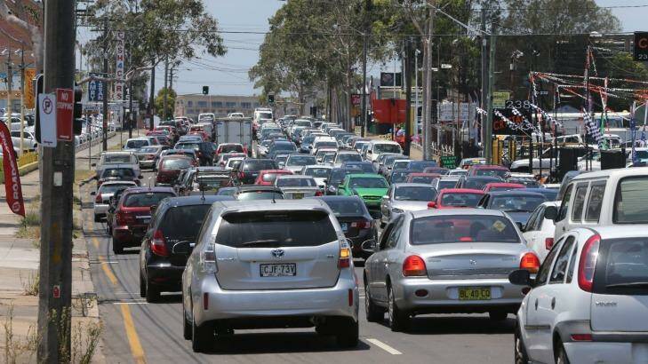 The Baird government says funds raised by the partial sale of electricity assets would fund infrastructure projects such as creating new bus priority laneways on Parramatta Road. Photo: Anthony Johnson