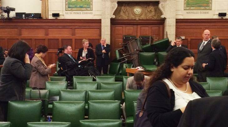 MPs block the door with chairs during a caucus meeting on Parliament Hill in Ottawa. Photo: Nina Grewal
