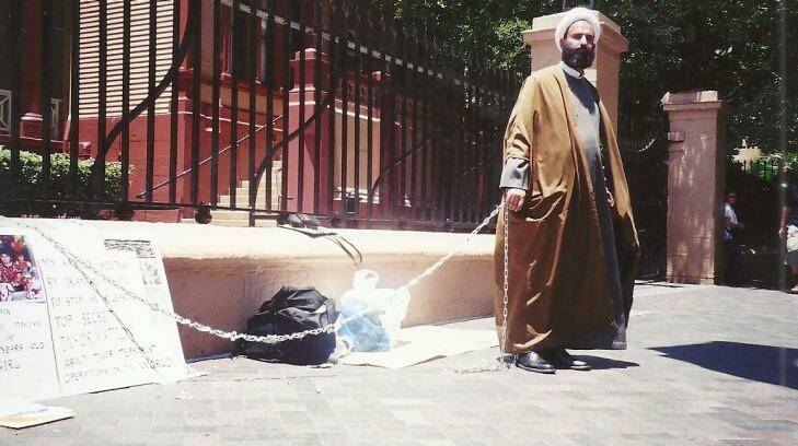 Man Monis chained himself to the fence outside NSW Parliament House in 2001.