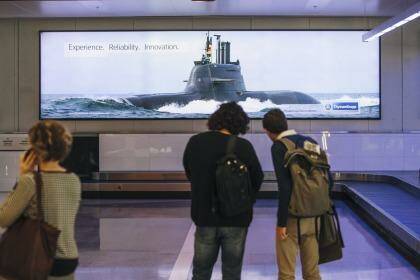 News
Advertising posters featuring warships,  submarines, and UAVs at Canberra Airport. 

25 August 2015
Photo: Rohan Thomson
The Canberra Times Photo: Rohan Thomson
