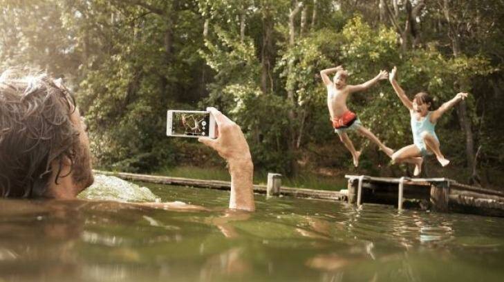 In this promotional shot the Xperia M4 Aqua is used in fresh water, which Sony says will not harm the device at all provided its rubber seals are firmly shut. Photo: Sony