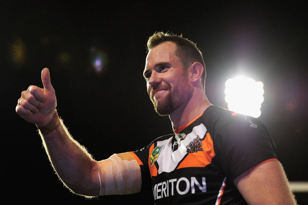 Pat Richards acknowledges the crowd after victory during the round 6 NRL match between the Wests Tigers and the North Queensland Cowboys. Picture: Brett Hemmings/Getty Images