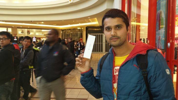 Ankit Benwal, a tourist from India, was the third person to get the new iPhone at the Chadstone store. He camped out with a friend since 10pm on Wednesday. He wanted to get the new phone straight away, rather than waiting for it to be delivered.

"It was fun waiting here, talking, making new friends," he said. Photo: Hanna Francis