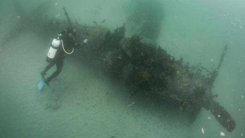 UNDERWATER ADVENTURE: Divers explore the wreck of VX 381 in Hare Bay. Photo: Mick Tait - www.micktait.com
