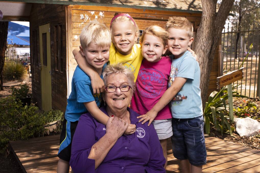 Adieu: Macarthur Preschool's Margret Bell - with Thomas Hazleton, Kensie Jeansch, Grace Edgerton and Archer Linden - recently retired after 35 years. Picture: Simon Bennett
