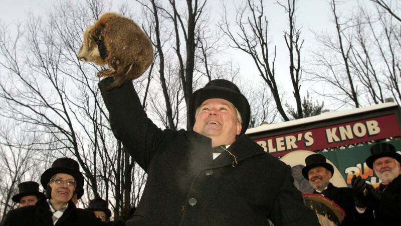 Official Groundhog Handler Bill Deeley holds Punxsutawney Phil up for the crowd on Gobblers Knob in Punxsutawney, Pennsylvania.