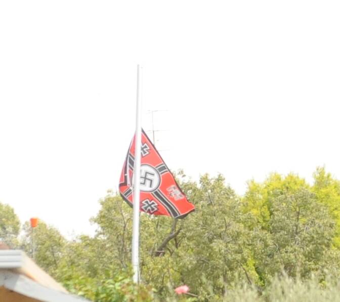 OUTCRY: The flag flying in Beleuh today. Picture: ALEXANDER DARLING