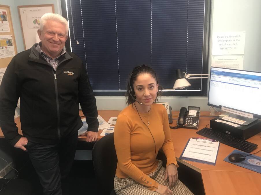 Here to help: One of Lifeline's crisis support volunteers with Lifeline Macarthur chief executive Brad Hannagan. Picture: Supplied
