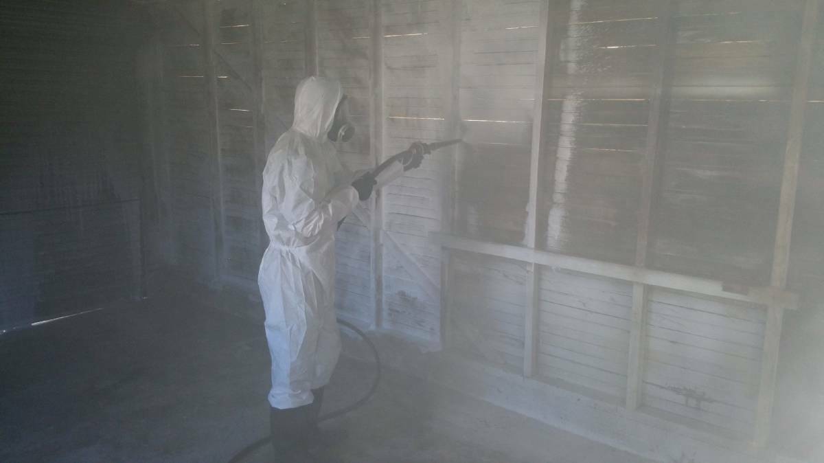 Meth contamination: A cleaner decontaminating a garage with chemical foam. Photo: Meth Lab Cleaners Australia.