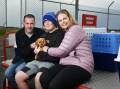HAPPY ENDING: Devonport's Leigh Murray, Oliver and Lisa Fittkau had tears in their eyes when they finally met Enza the cavoodle on Saturday. Picture: Brodie Weeding
