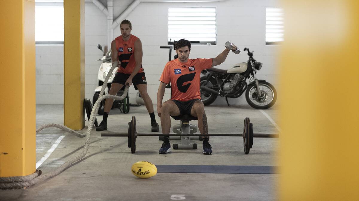 GWS Giants AFL players Tim Taranto and Harry Himmelberg train in isolation at their home in Sydney on April 14. AFL players across the country are now training in isolation under strict policies in place due to the Covid-19 pandemic. Photo: Ryan Pierse/Getty Images