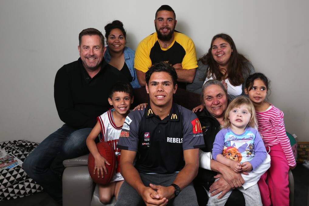 MUCH LOVED: Jamaine Jones (front centre) with family and friends in Heywood in November 2016, just before he was drafted into the AFL. 