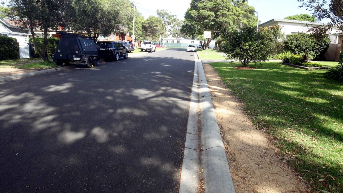 Remediation work next to a rolled kerb in North Caringbah. Picture by Chris Lane