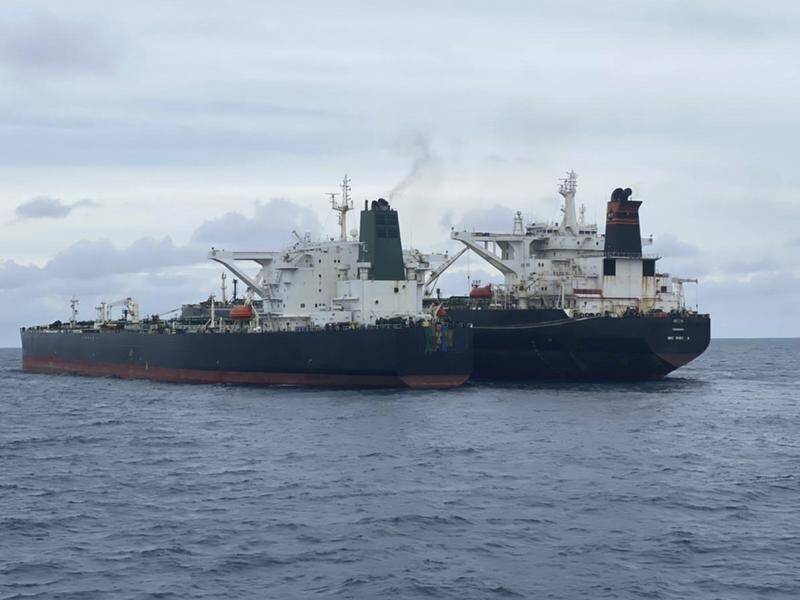 The two tankers are seen anchored together in Pontianak waters off Borneo island.