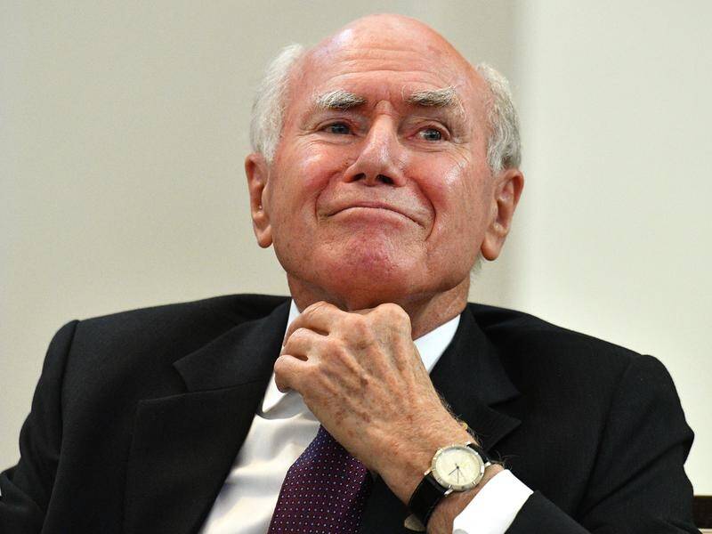 Former prime minister John Howard has been praised for intervening in a domestic violence incident.