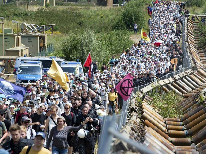 Thousands of German climate activists have protested against the Garzweiler open-cast coalmine.