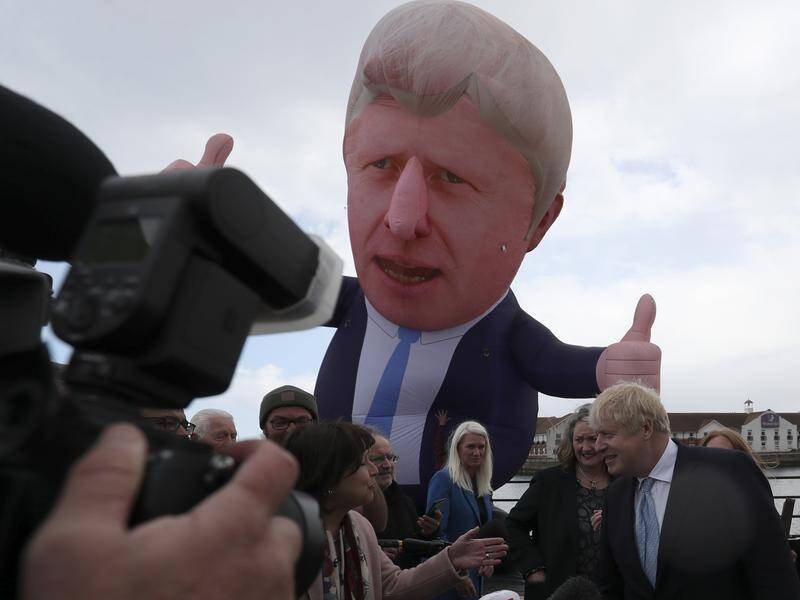 UK PM Boris Johnson spoke to reporters in Hartlepool next to a large inflatable form of himself.