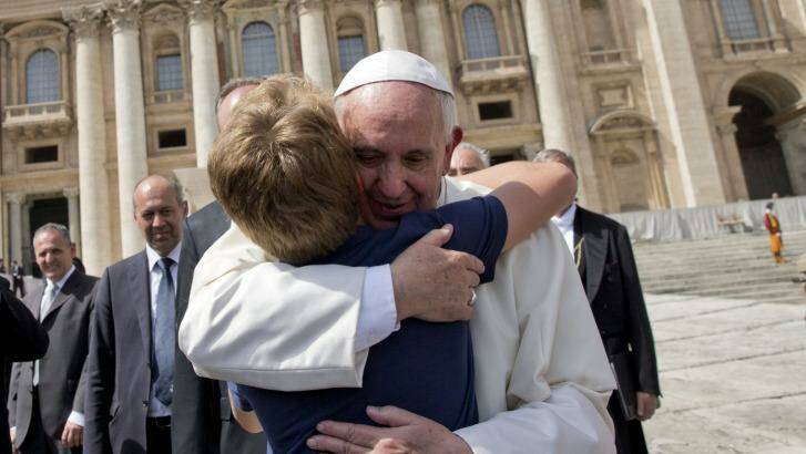 Pope Francis hugs a young boy at the end of his weekly general audience in St Peter's Square on Wednesday. Photo: Andrew Medichini/AP
