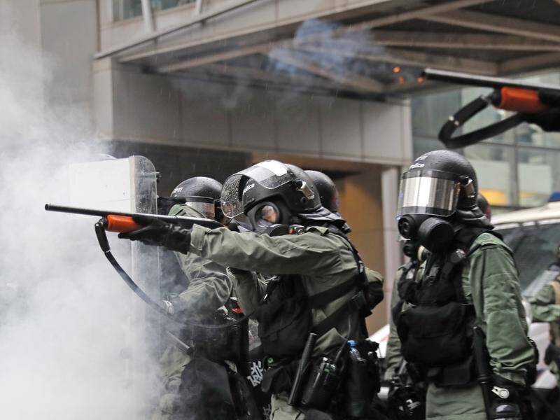 Riot policemen have fired weapons during a confrontation with demonstrators in Hong Kong.