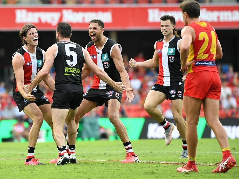 St Kilda celebrate beating the Suns by nine points in their AFL clash on the Gold Coast.