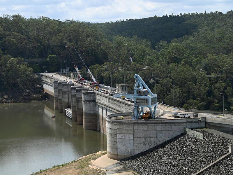 Water restrictions will ease across Sydney since dam levels rose after recent heavy downpours.