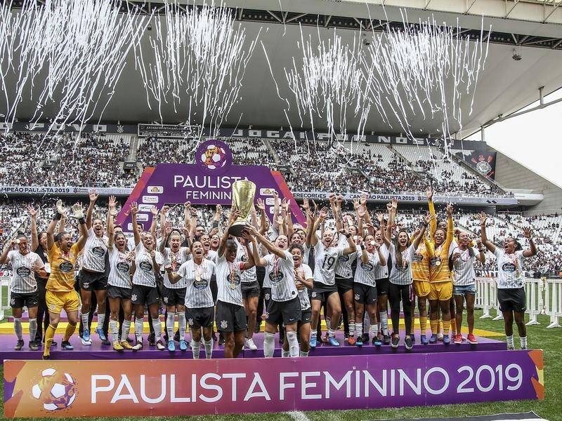Corinthians players celebrate their Paulista Women's Championship title victory.