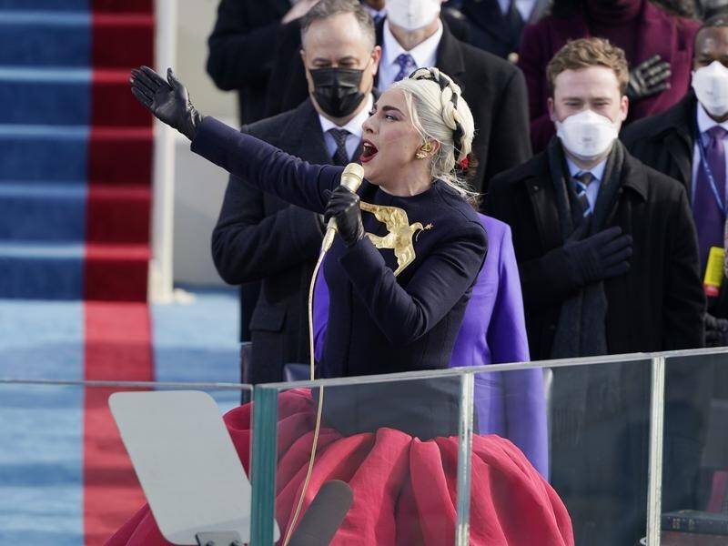 Lady Gaga sings the US national anthem at the inauguration ceremony.