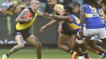Dustin Martin is out of Richmond's AFL clash with Gold Coast because of a hamstring injury.