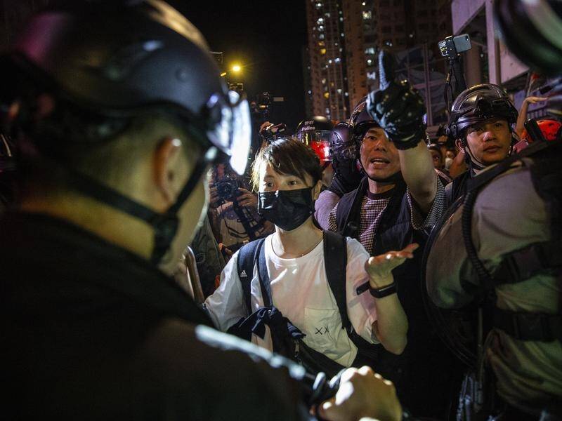 Protesters have hurled petrol bombs and police fired tear gas in renewed clashes in Hong Kong.
