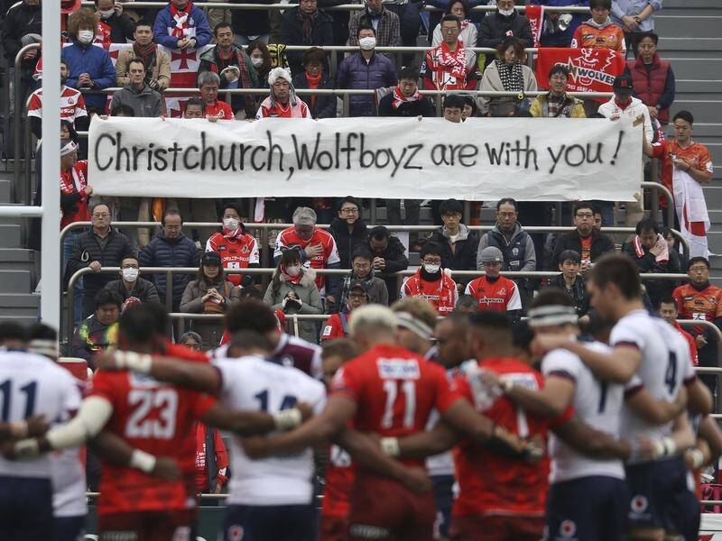 Reds and Sunwolves players mark a minute's silence for victims of the Christchurch terror attack.