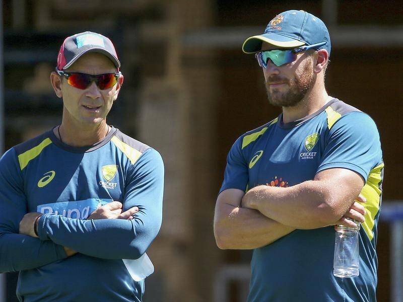 Aaron Finch (r) says coach Justin Langer (l) has done a fantastic job in recent months especially.