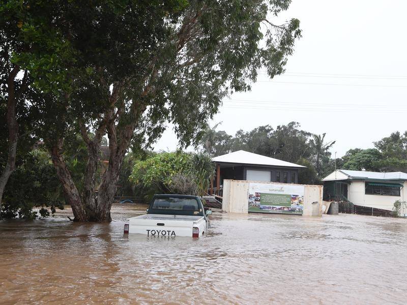 Torrential rain has flooded northern NSW, causing deaths and widespread property damage.