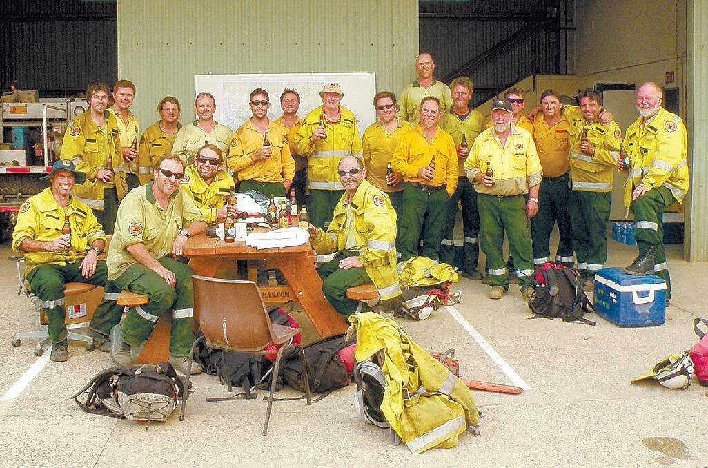 The National Parks and Wildlife Service crew celebrates a successful operation to protect the Mountains.